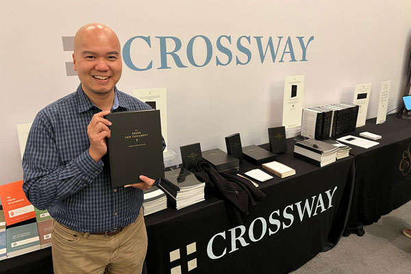 Daniel Eng holding New Testament