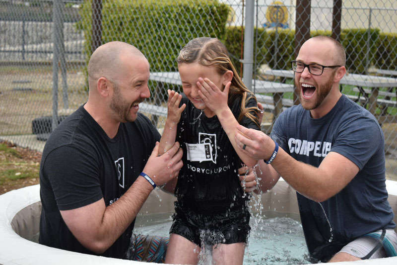 young person getting baptized