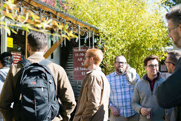 students eating at food carts