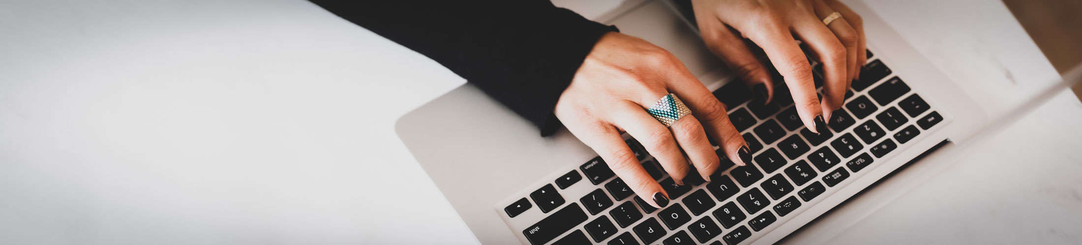 woman typing on keyboard